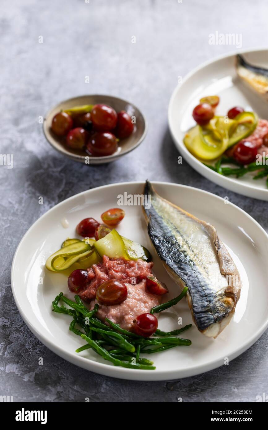 Grilled mackerel with gooseberry ketchup, pickled cucumber and whole
