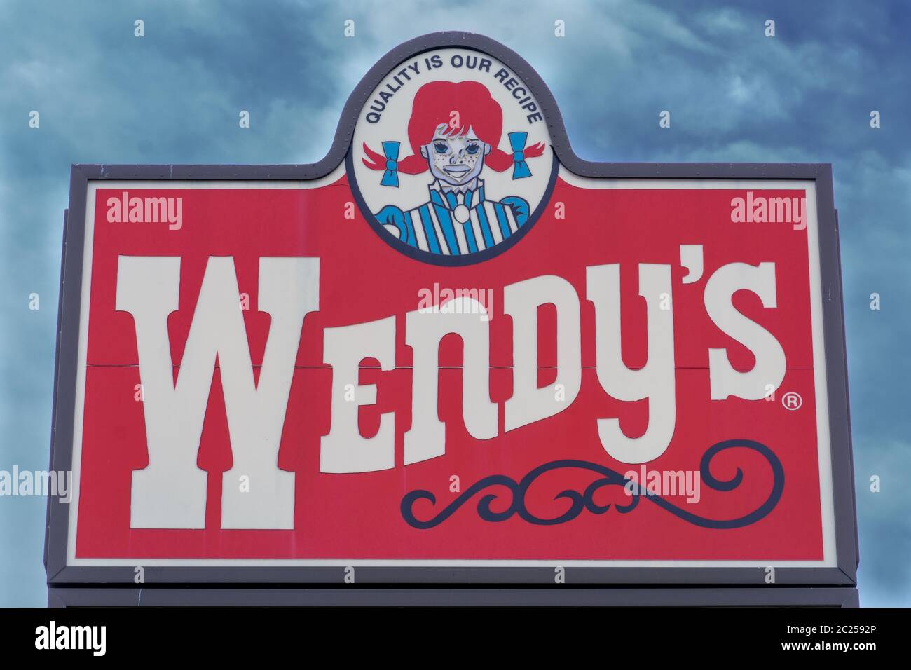 Wendy's Restaurant Quality is our recipe old huge sign with sky background photograph Stock Photo