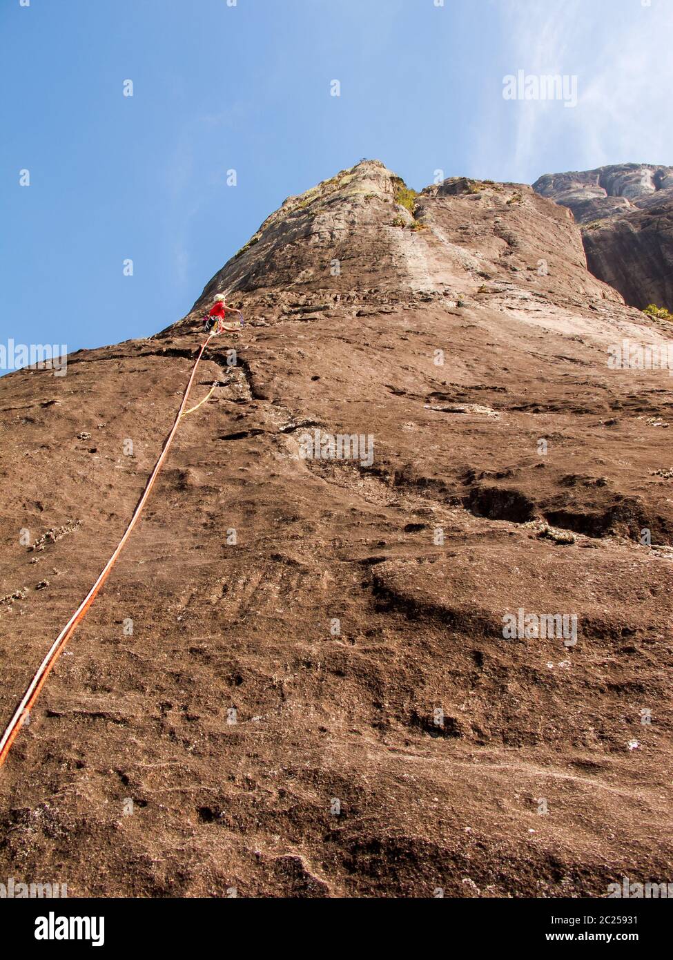Rock climber climbing a sloping rock wall in Brazil Stock Photo Alamy