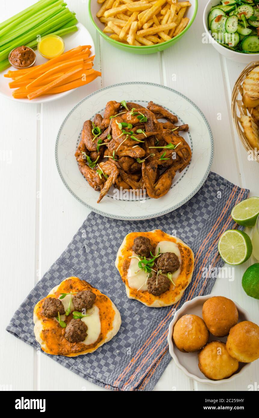 Chicken wings, vegetable, french fries, pizza, donuts, lime juice, dip