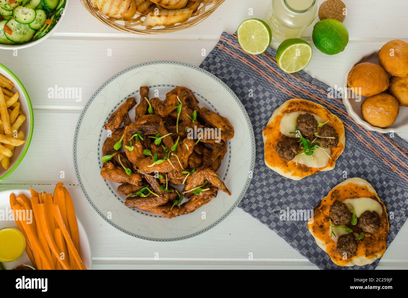 Chicken wings, vegetable, french fries, pizza, donuts, lime juice, dip