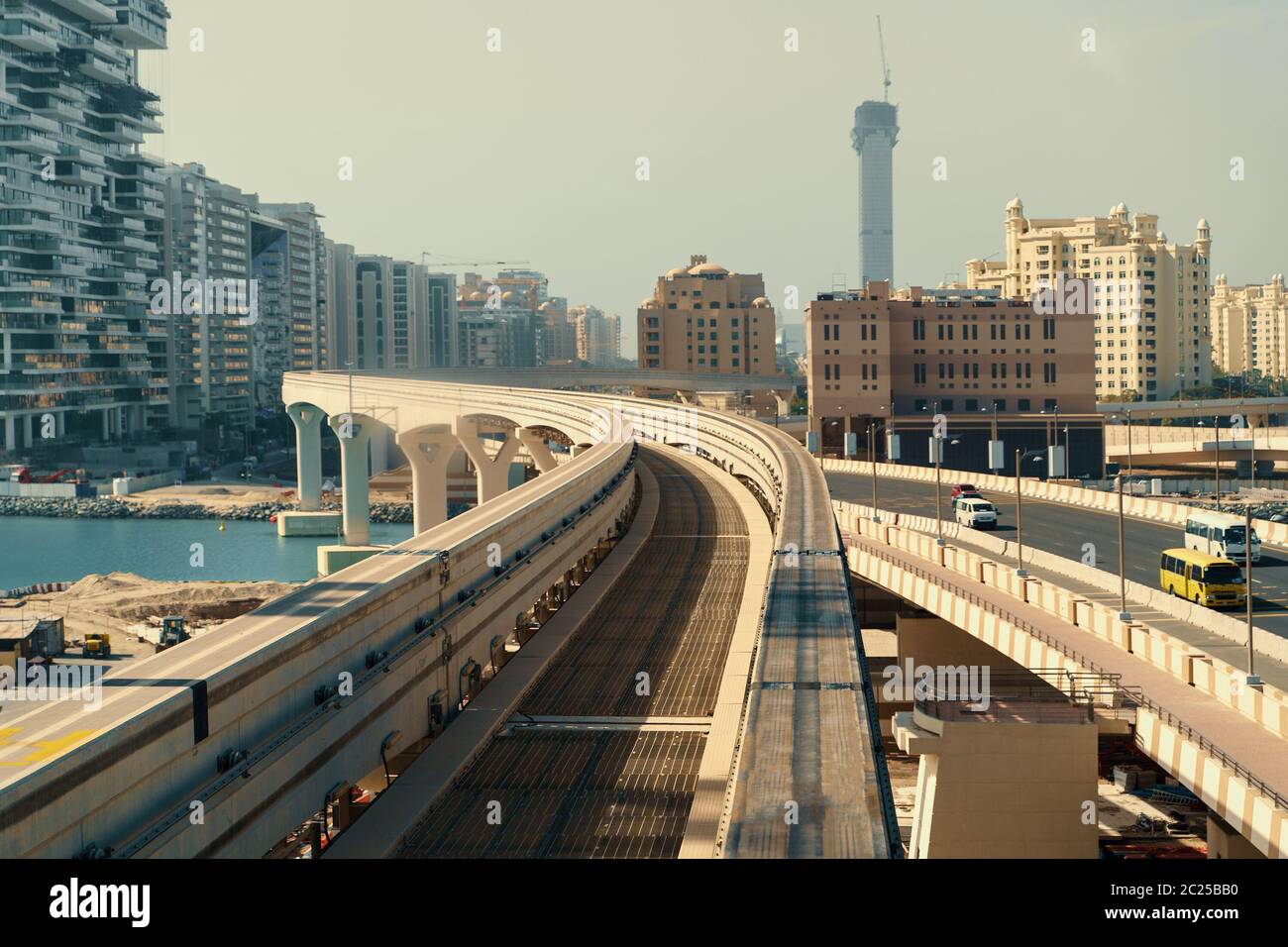 Modern monorail for train in Dubai moving on palm tree shaped island