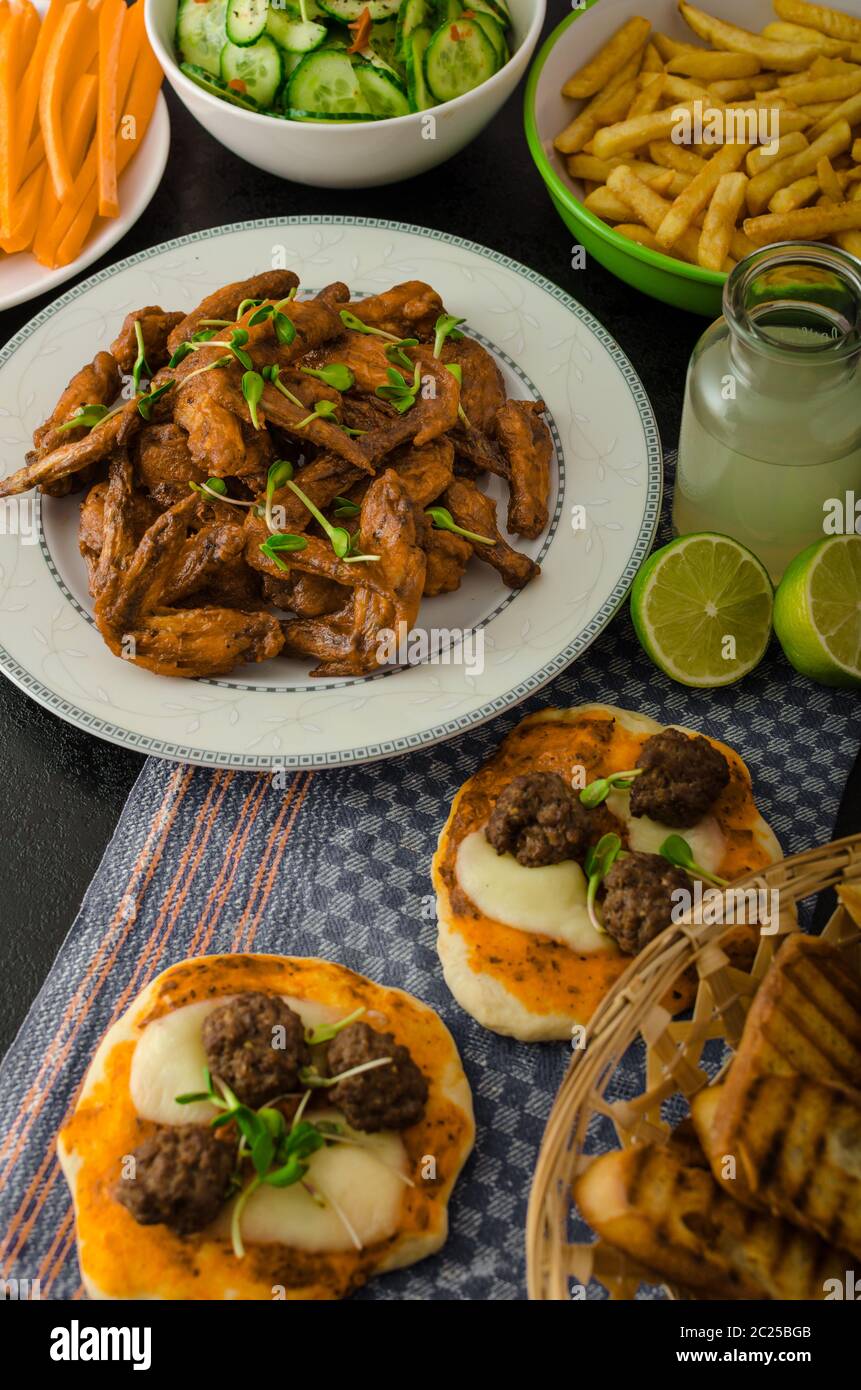 Chicken wings, vegetable, french fries, pizza, donuts, lime juice, dip