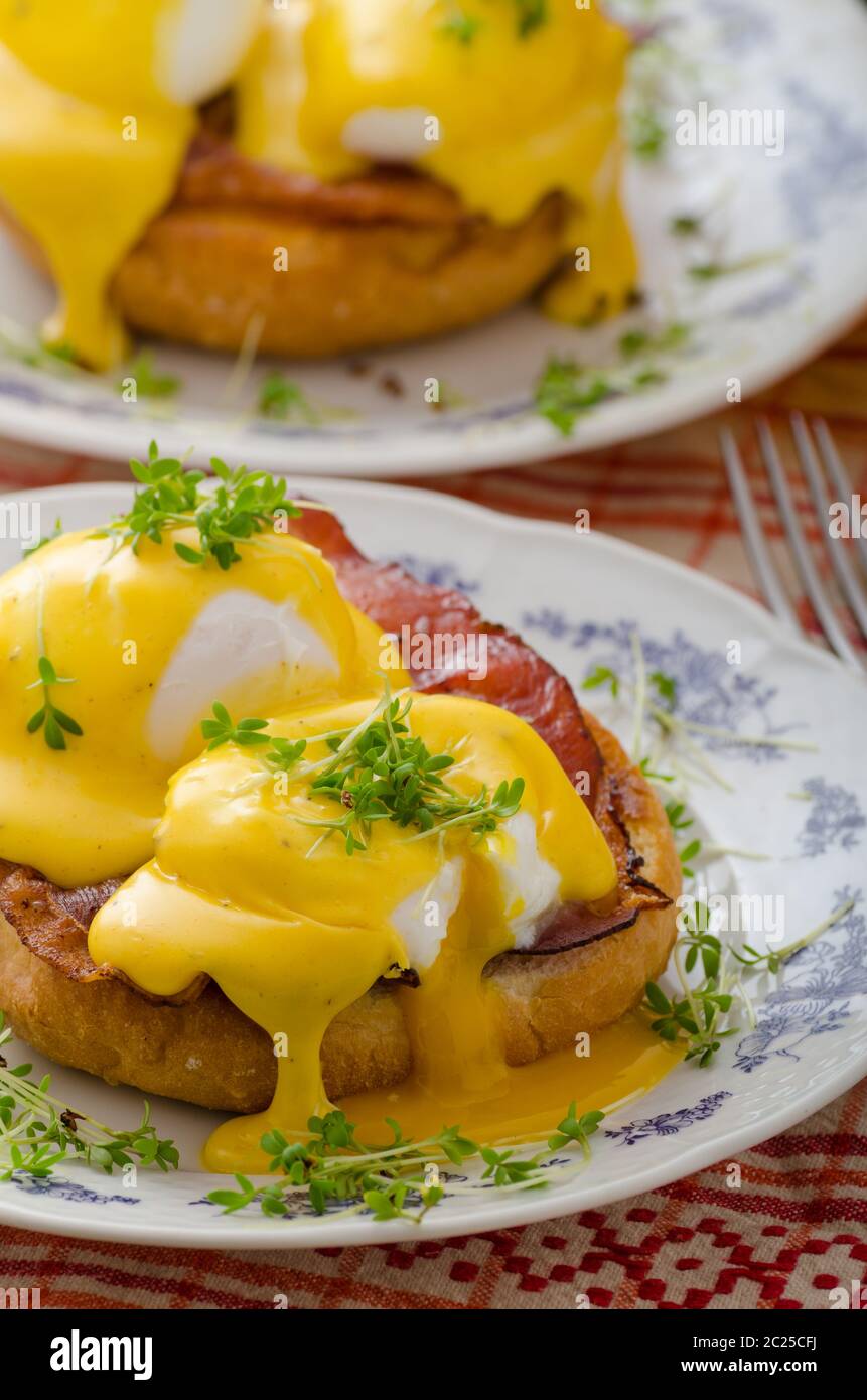 Eggs benedict, prosciutto topped with Hollandaise sauce Stock Photo Alamy