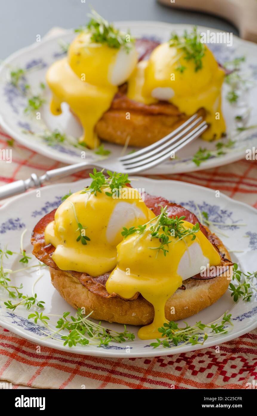 Eggs benedict, prosciutto topped with Hollandaise sauce Stock Photo Alamy