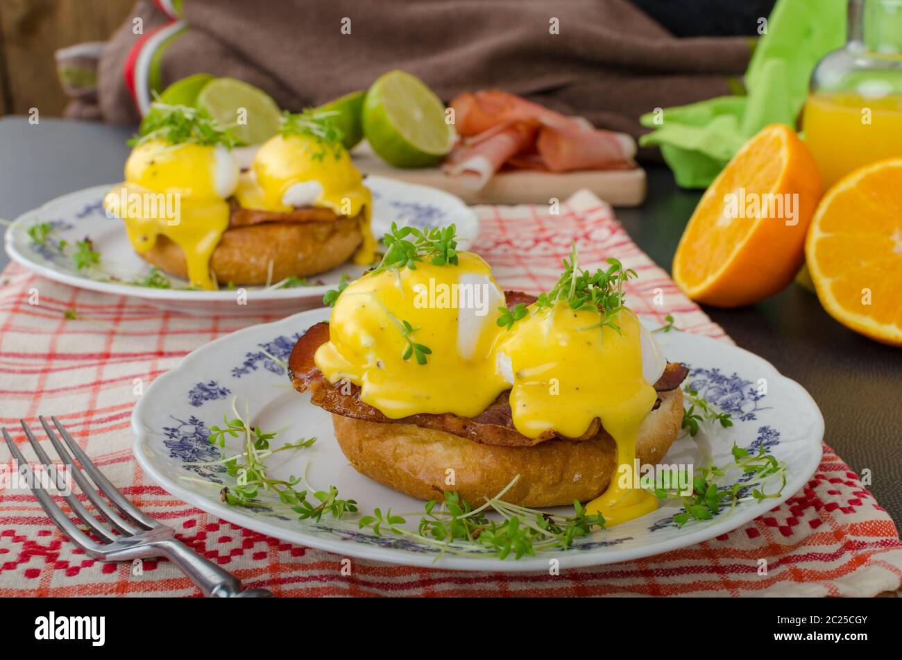 Eggs benedict, prosciutto topped with Hollandaise sauce Stock Photo Alamy