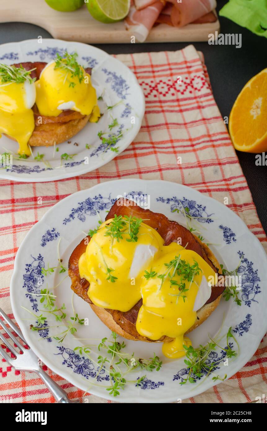 Eggs benedict, prosciutto topped with Hollandaise sauce Stock Photo Alamy