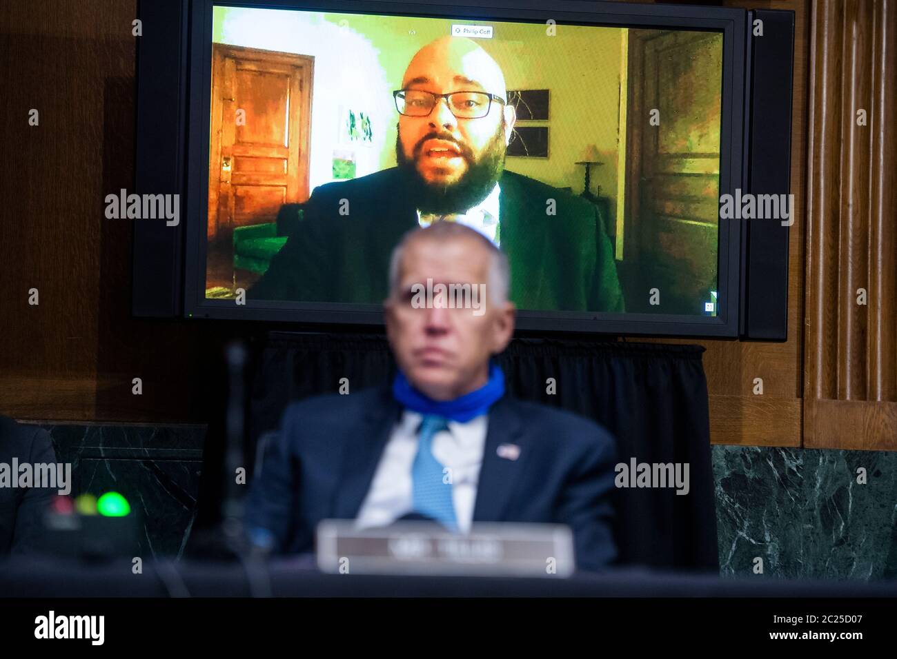 Washington, DC. 16th June, 2020. Dr. Phillip Atiba Goff, Franklin A. Thomas Professor in Policing Equity at John Jay College of Criminal Justice, co-founder and CEO of Center for Policing Equity, testifies remotely as United States Senator Thom Tillis (Republican of North Carolina), looks on, during the US Senate Judiciary Committee hearing titled 'Police Use of Force and Community Relations,' in Dirksen Senate Office Building in Washington, DC, on Tuesday, June 16, 2020. Credit: Tom Williams/Pool via CNP | usage worldwide Credit: dpa/Alamy Live News Stock Photo