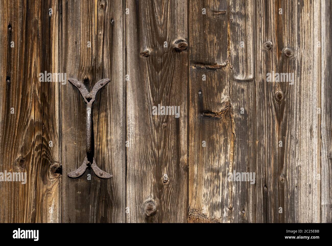Door fittings on an old barn door Stock Photo Alamy