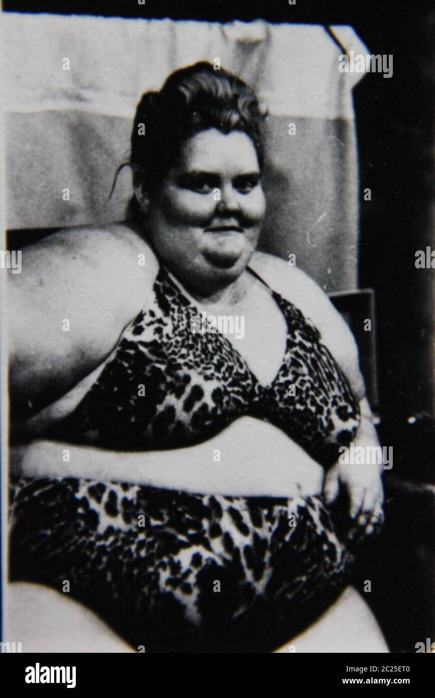 Fine 70s vintage black and white extreme photography of an overweight woman wearing a leopard print bikini. Stock Photo