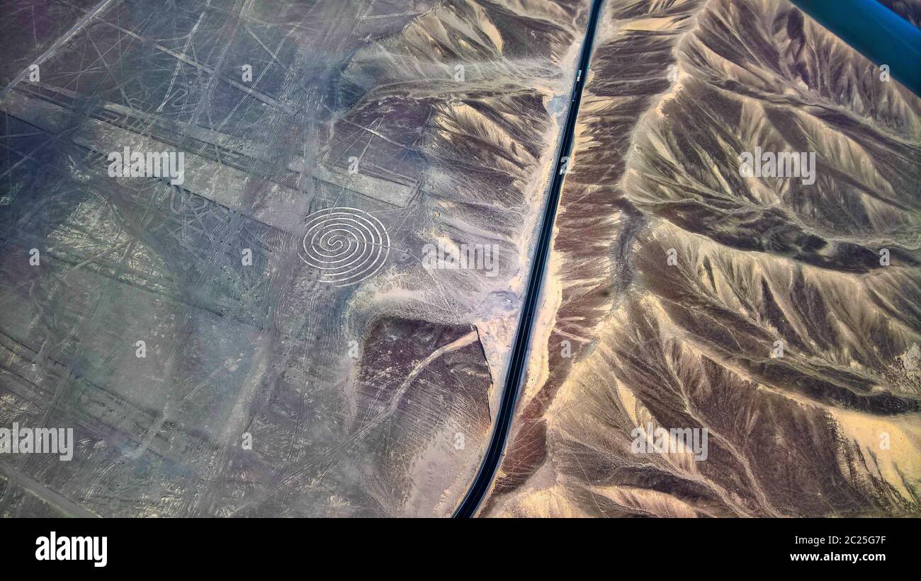 Aerial airplane panoramic view to Nazca geoglyph lines aka spiral, Ica ...