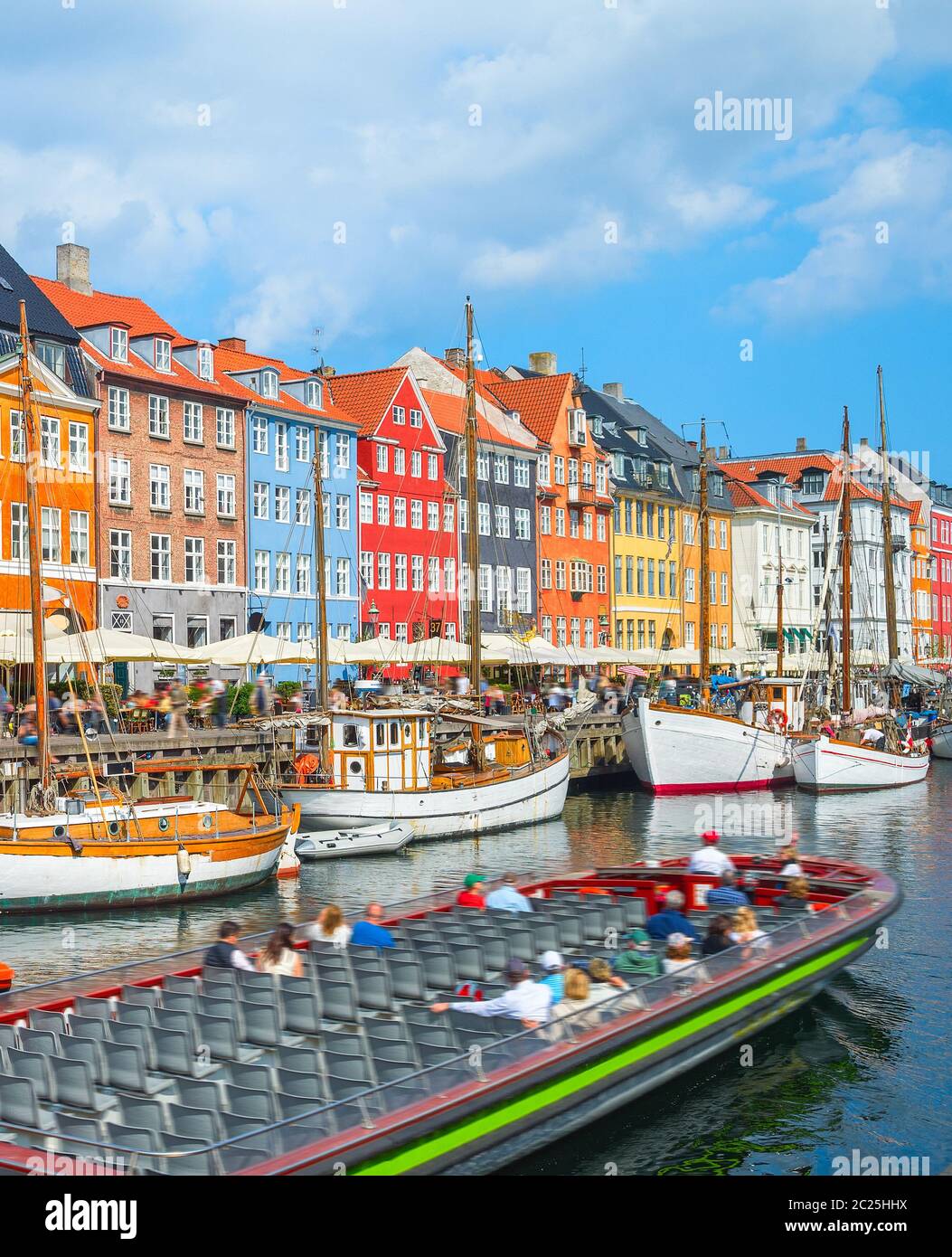 Tour boat in Nyhavn harbor Stock Photo