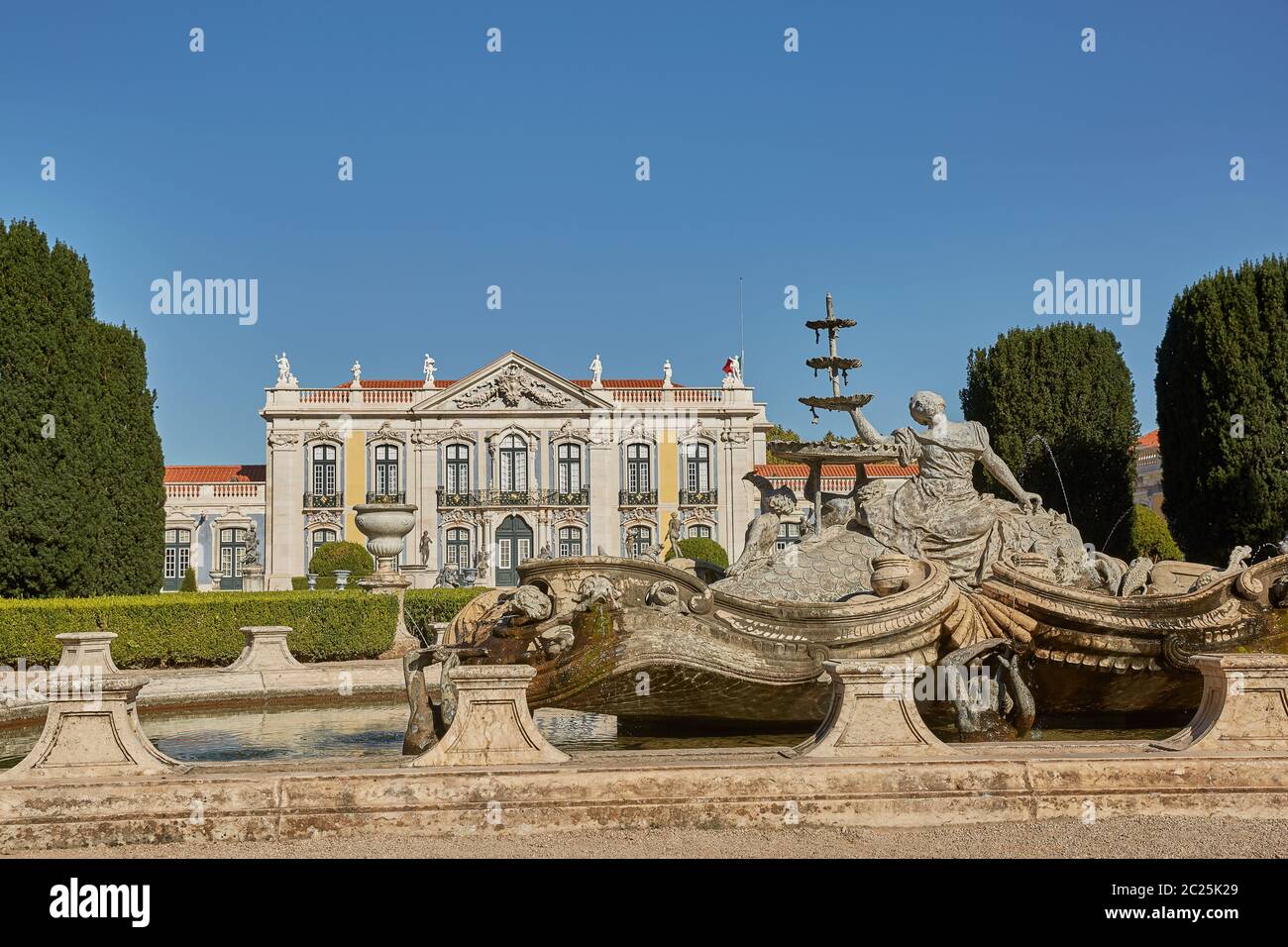 Facade, fountain and gardens of Queluz Palace in Sintra, Portugal during summer day. Stock Photo