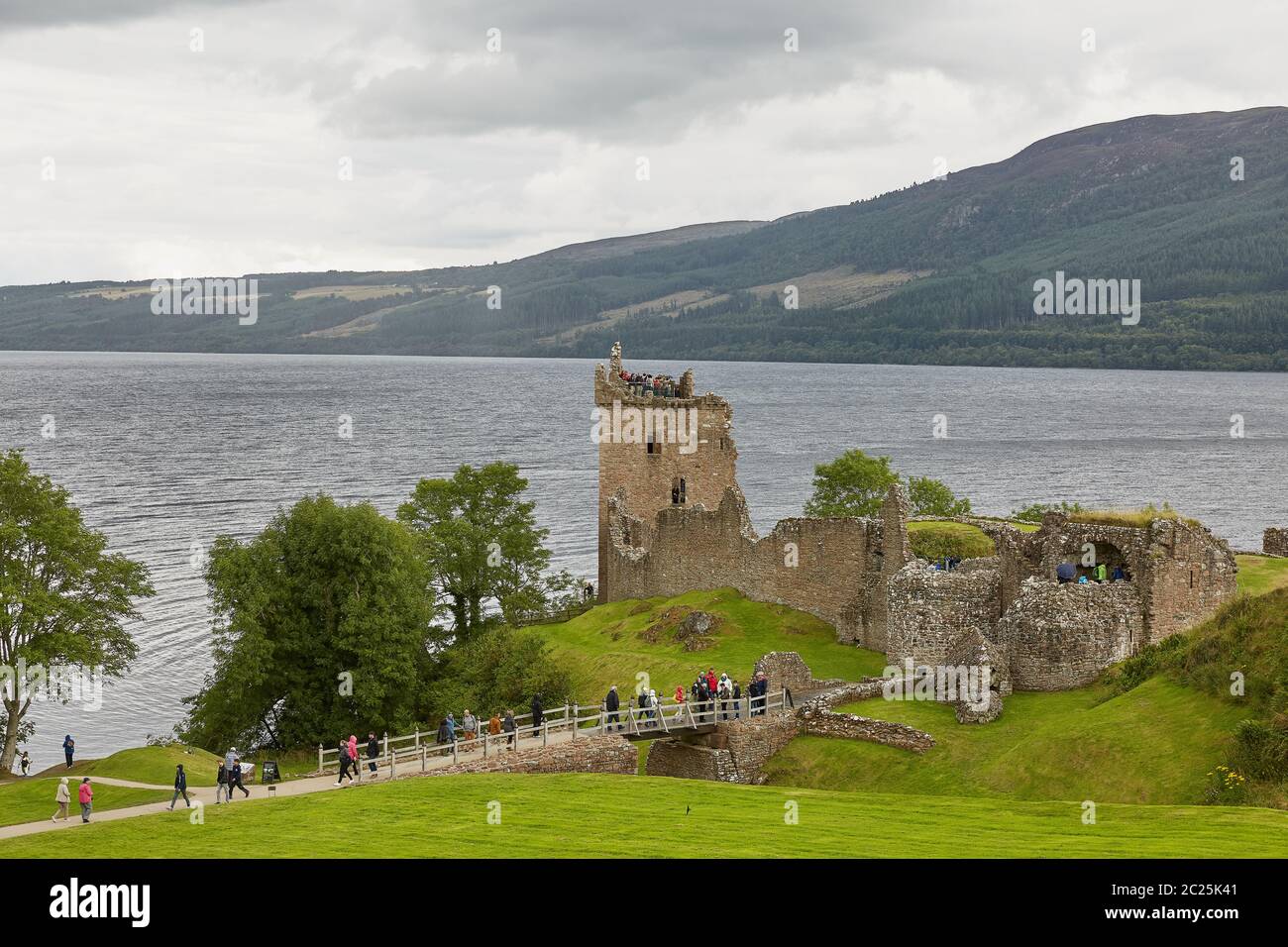 People enjoying vist at Urquhart Castle on the Shore of Loch Ness, Scotland. Stock Photo