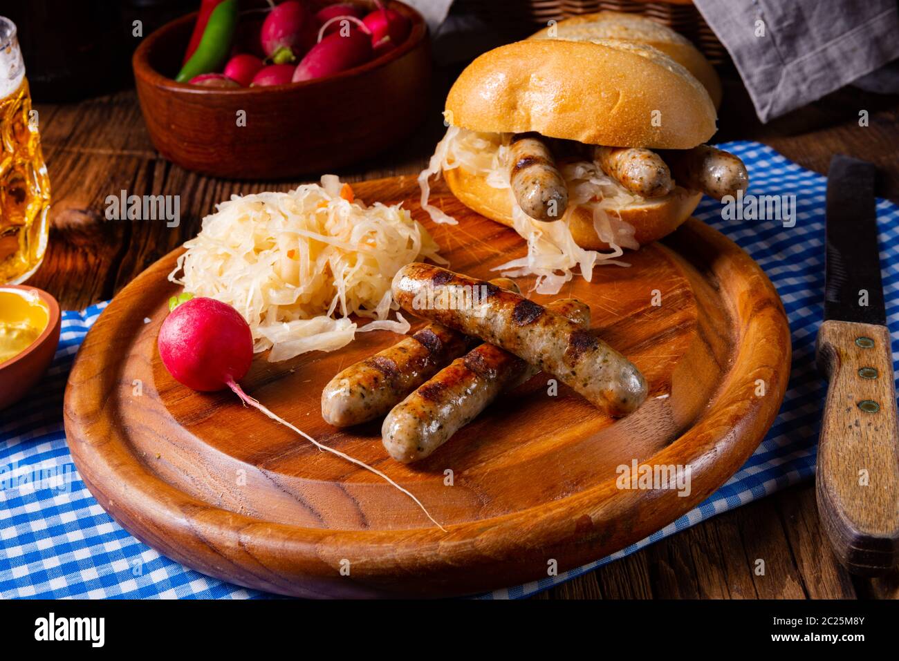 rustic Nürnberger bratwurst with sauerkraut and roll Stock Photo - Alamy