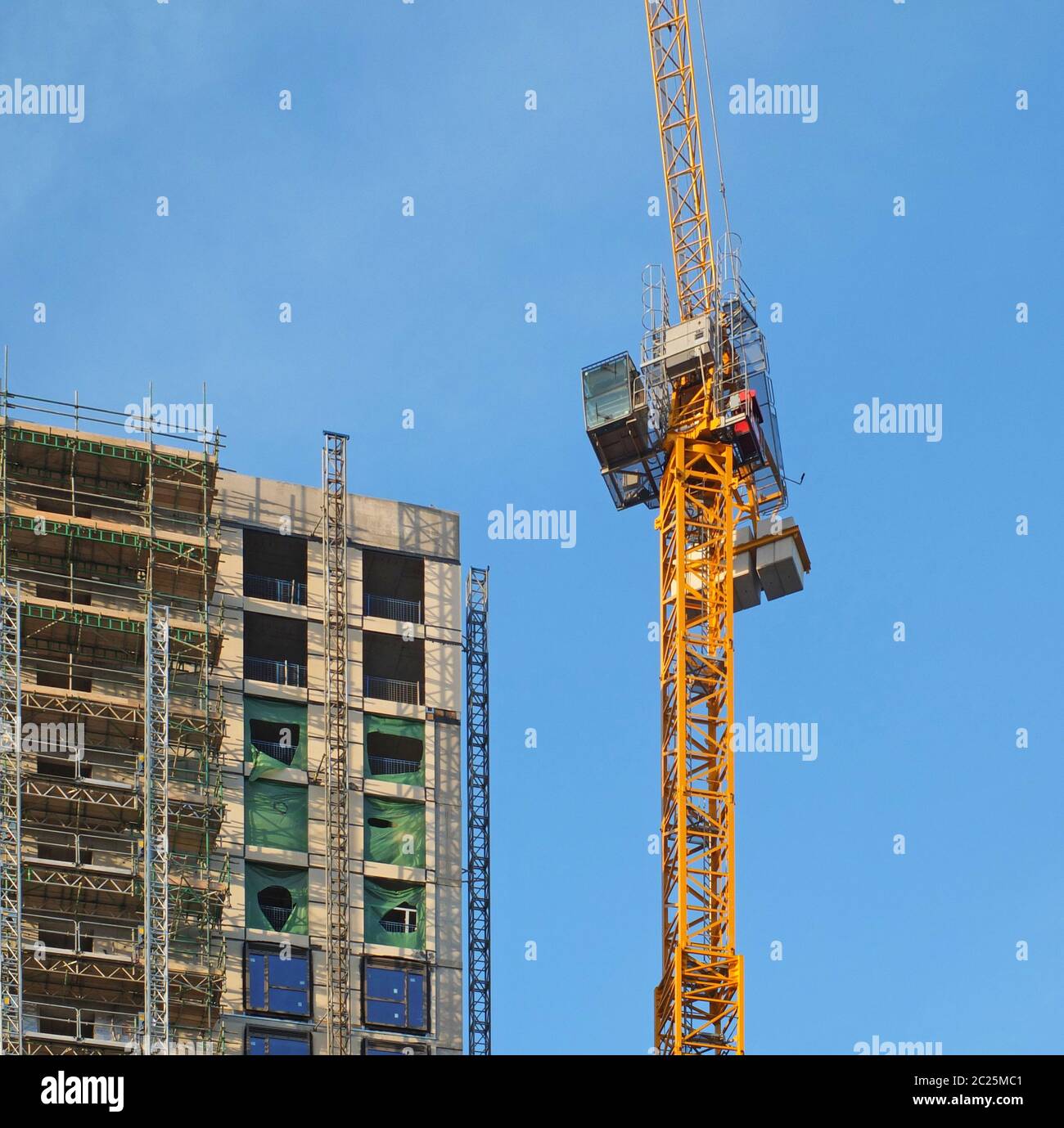 Tall yellow construction crane hi-res stock photography and images - Alamy