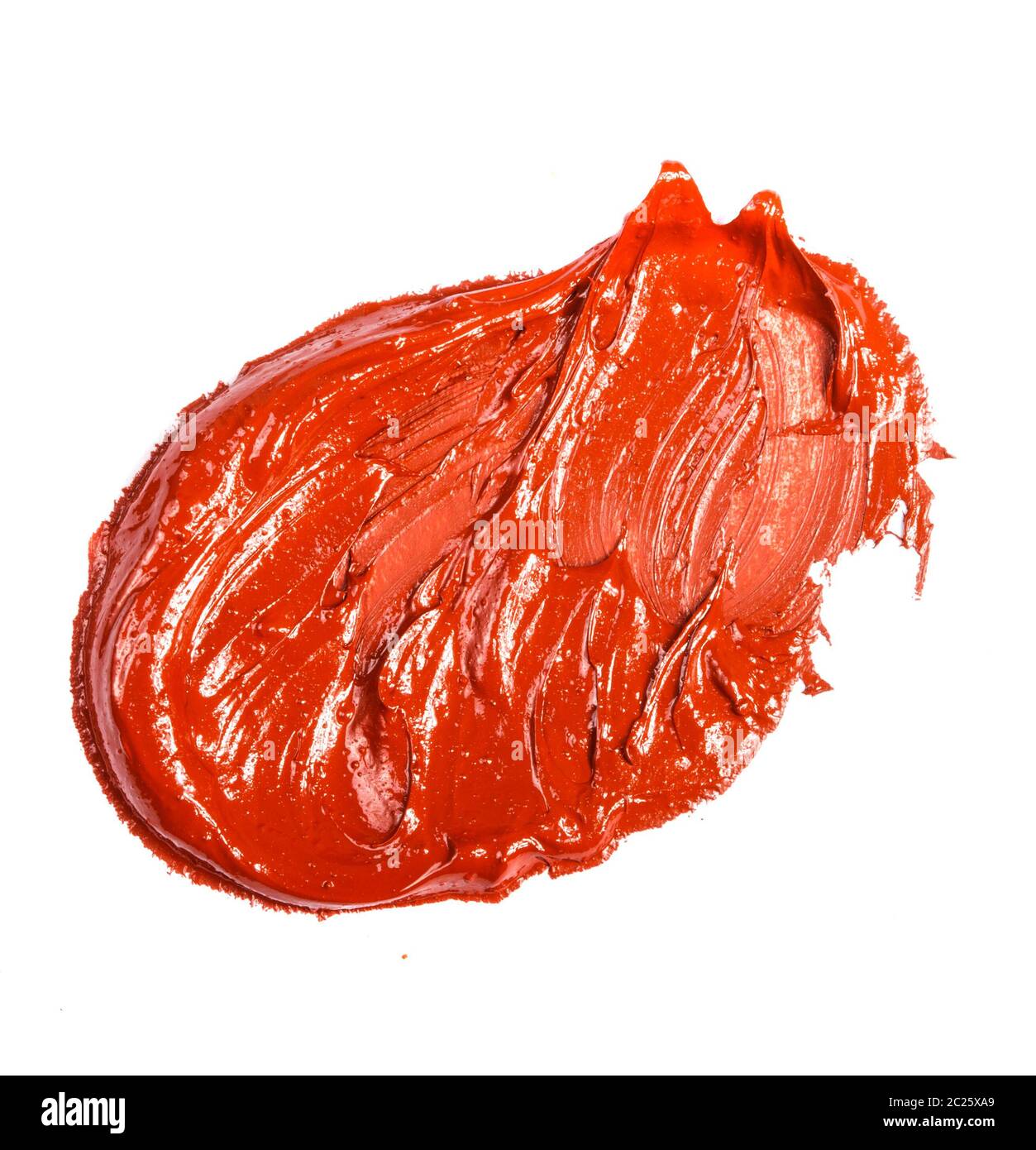 stain of red-orange oil paint on a white Stock Photo