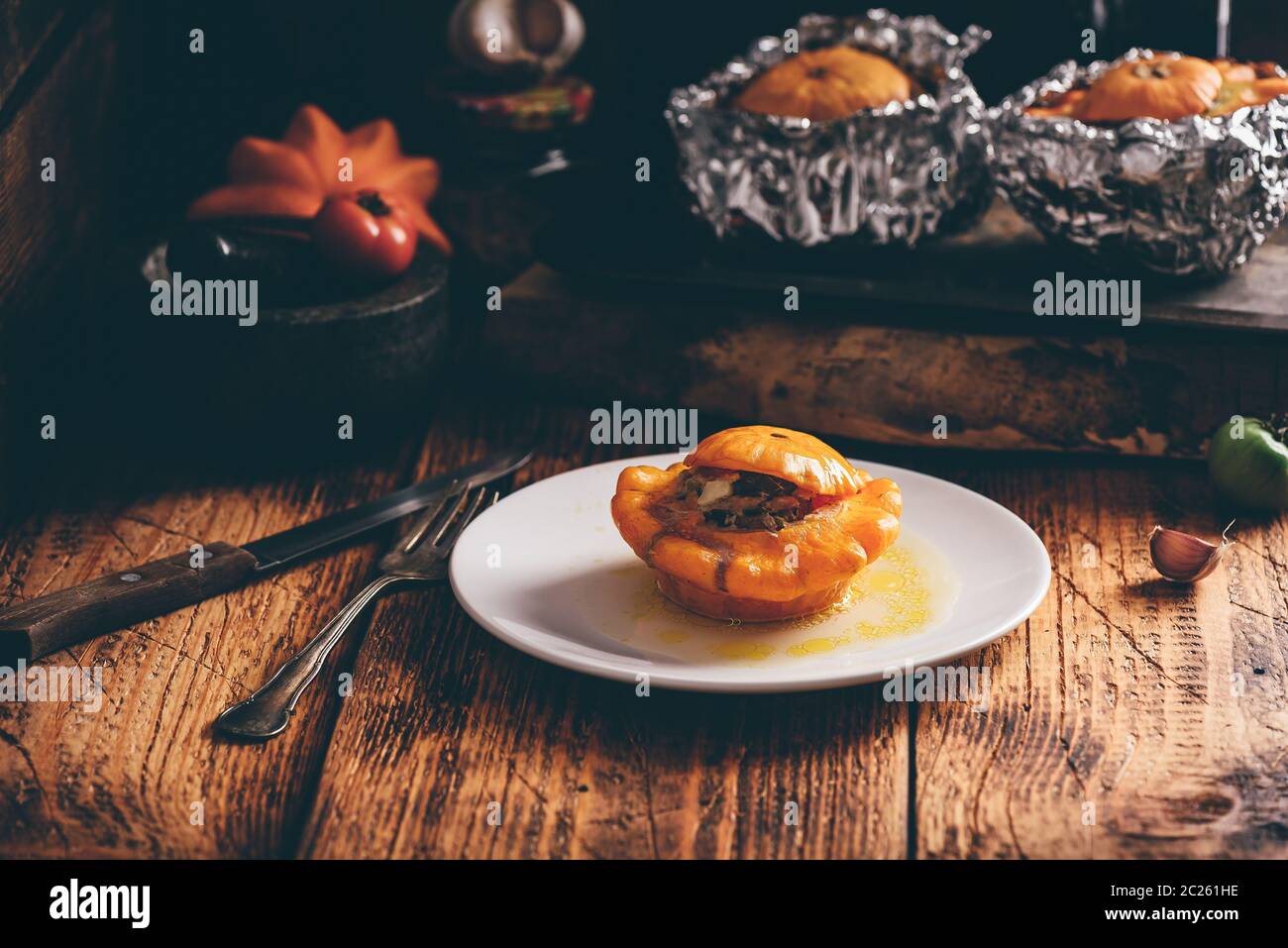 Baked Pattypan squash stuffed with ground meat on white plate Stock ...