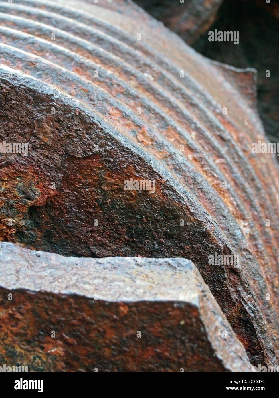 a close up of rusting brown steel machinery with rough texture and grooves Stock Photo