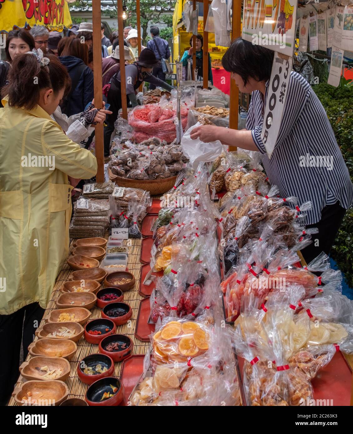 Food vendor selling food to customer during Kameido Tenjin Shrine