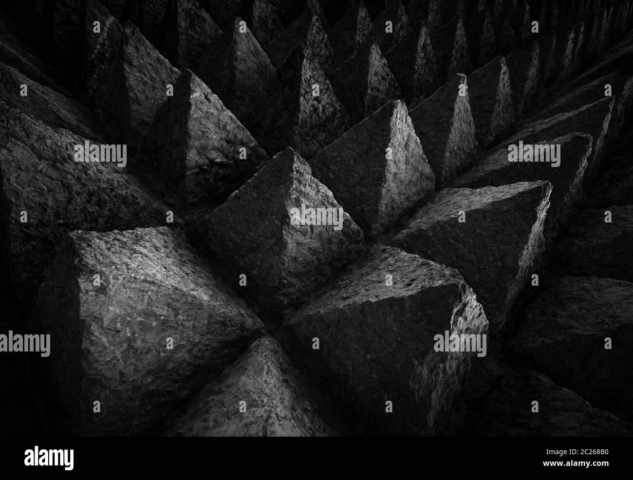 Sharp tip concrete architecture texture background. Art picture of unique pattern of dark stone carving in pointed triangle shape. Concept of obstacle Stock Photo