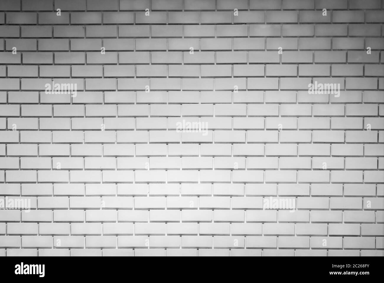 White brick wall texture background with space for text. White brick