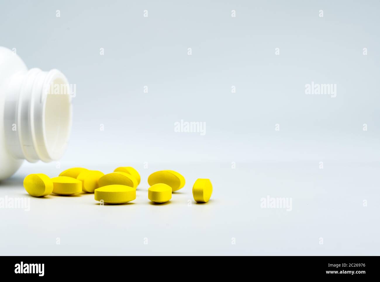 Download Yellow Oval Tablet Pills And Opened White Bottle On White Background With Beautiful Creative Pattern And Copy Space For Text Mild To Moderate Pain Ma Stock Photo Alamy PSD Mockup Templates