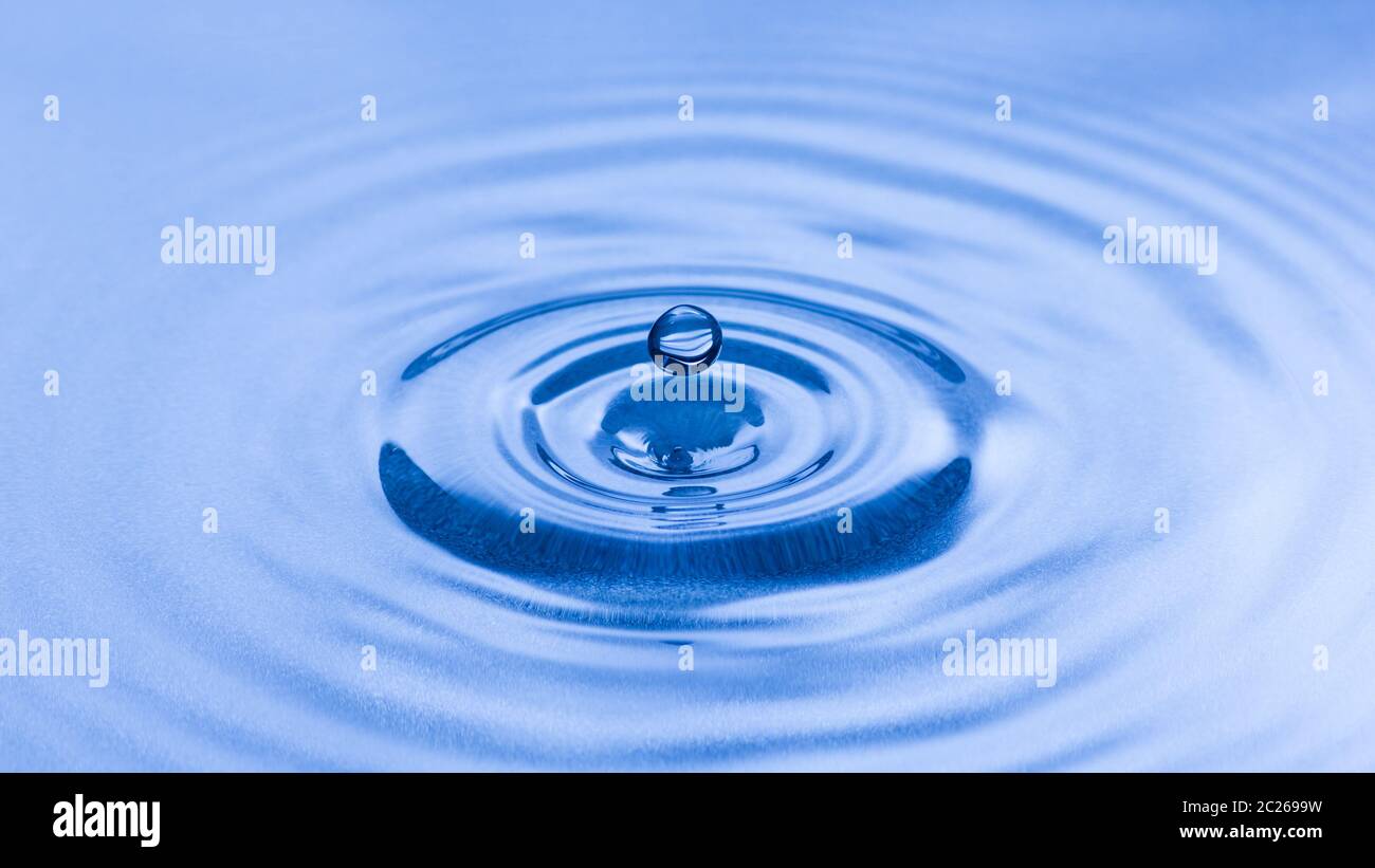 Blue water splash droplet macro. Purity, relaxation and environment concept. Stock Photo