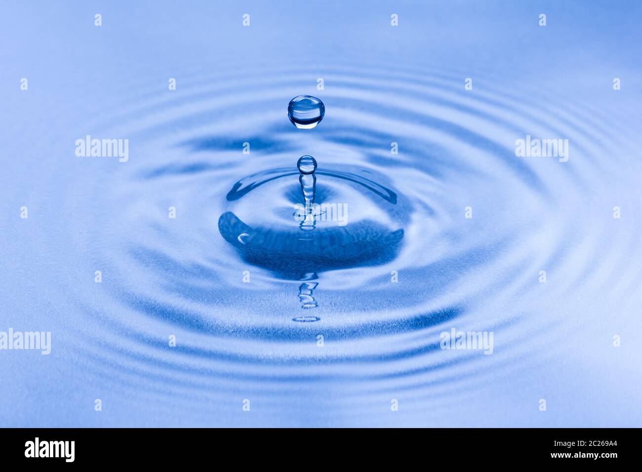 Blue water splash droplet macro. Purity, relaxation and environment concept. Stock Photo