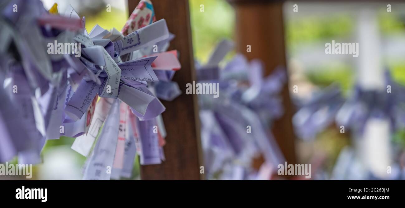 Random fortunes written on strips of paper or o-mikuji at Shinto shrines, Tokyo, Japan Stock Photo