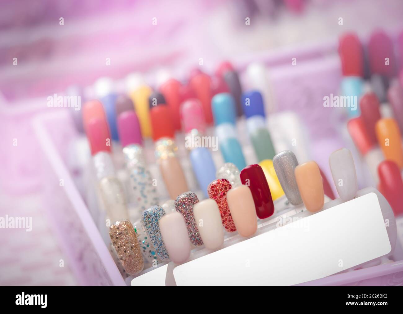 Colorful artificial Nails in nail salon shop. Set of false nails for