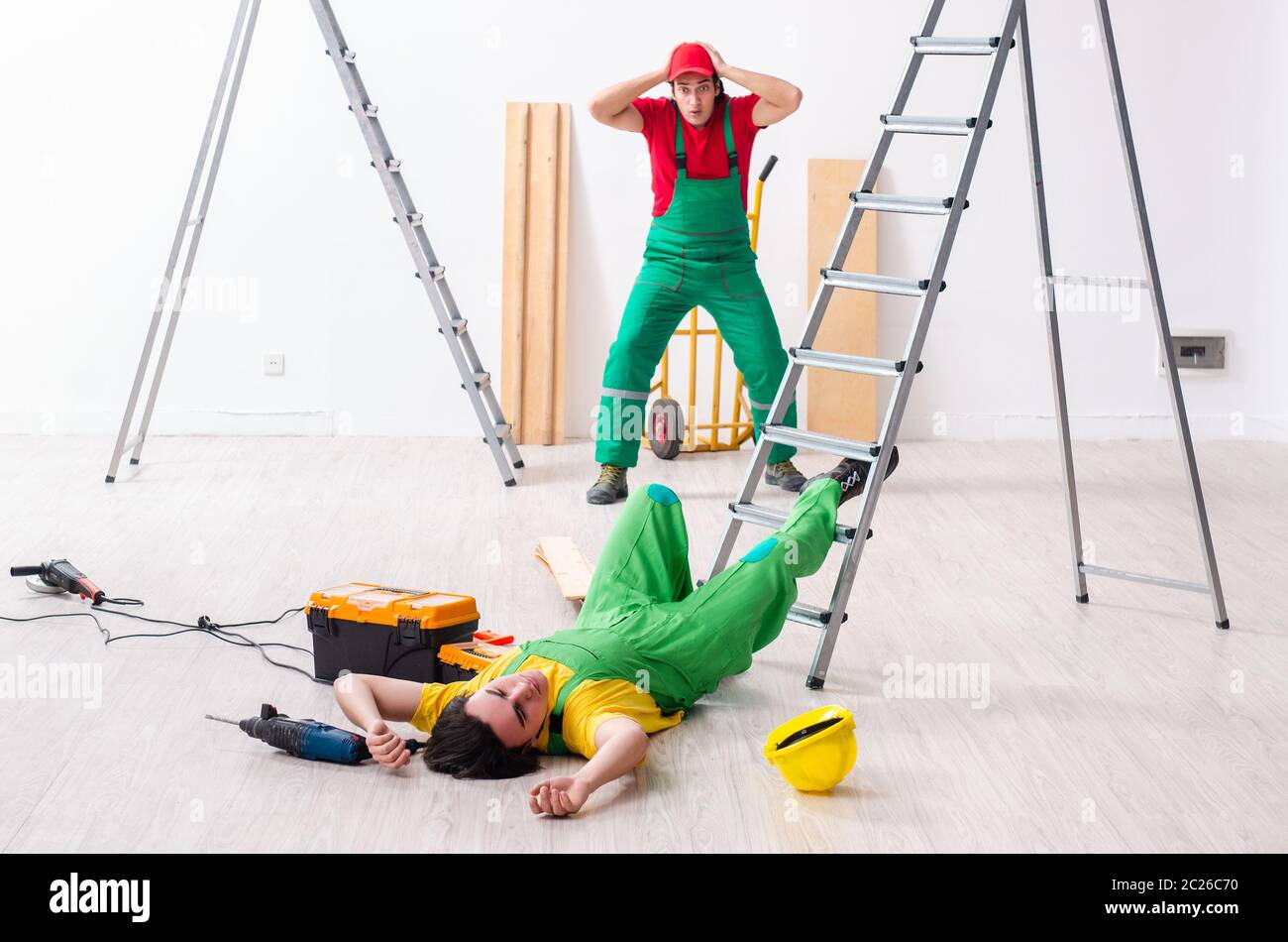 Injured worker and his workmate Stock Photo