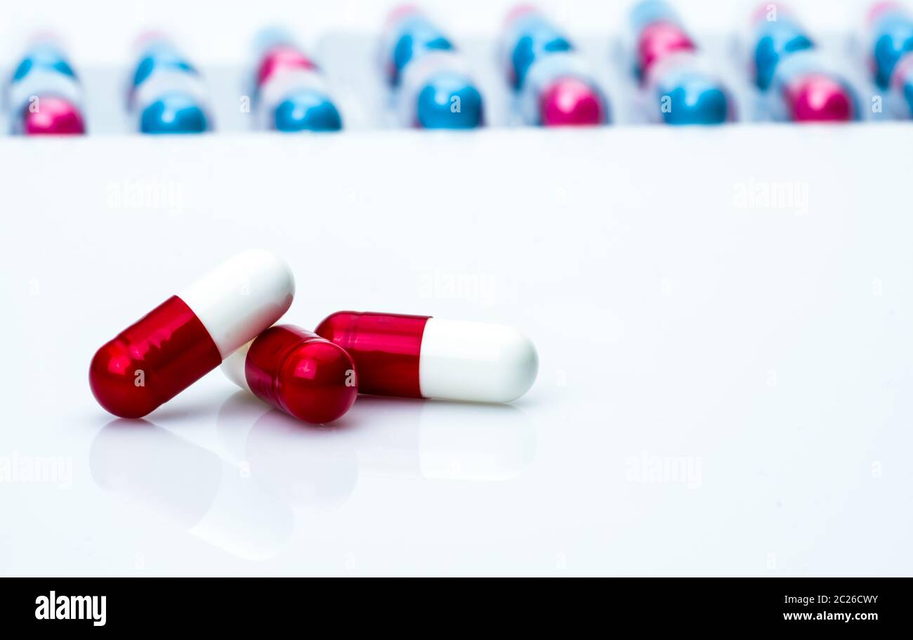 Redwhite antibiotic capsule pills on pills pack blurred background