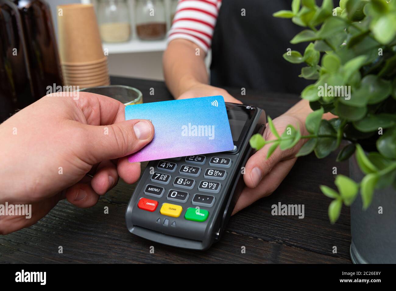 Customer making wireless or contactless payment using credit card Stock ...