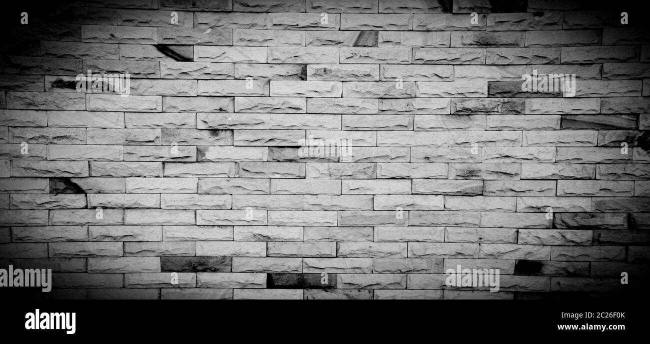 Black and white brick wall for background with copy space for text ...
