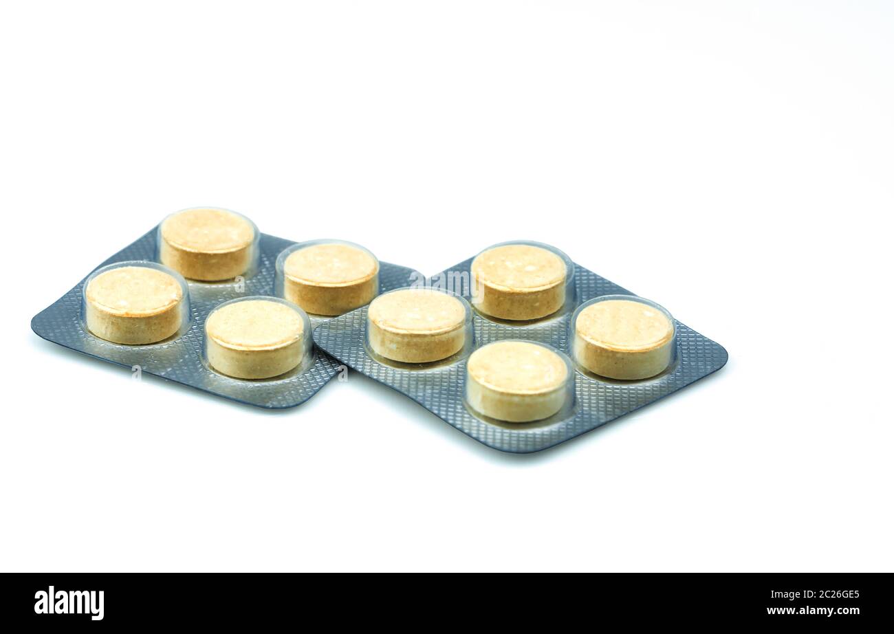 Anthelmintic tablets pills in blister packs on white background with copy space. Set of four tablets pills : niclosamide and phenolphthalein for treat Stock Photo