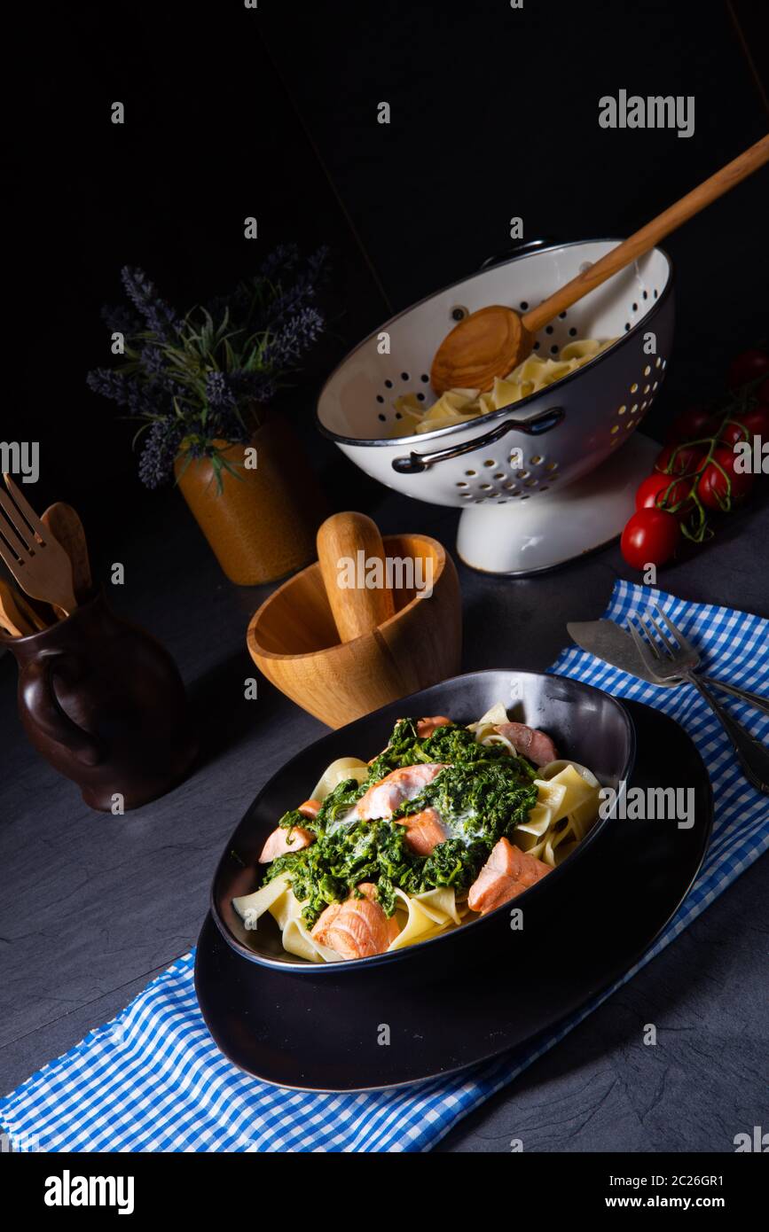 pappardelle pasta with creamed spinach and fried salmon Stock Photo Alamy