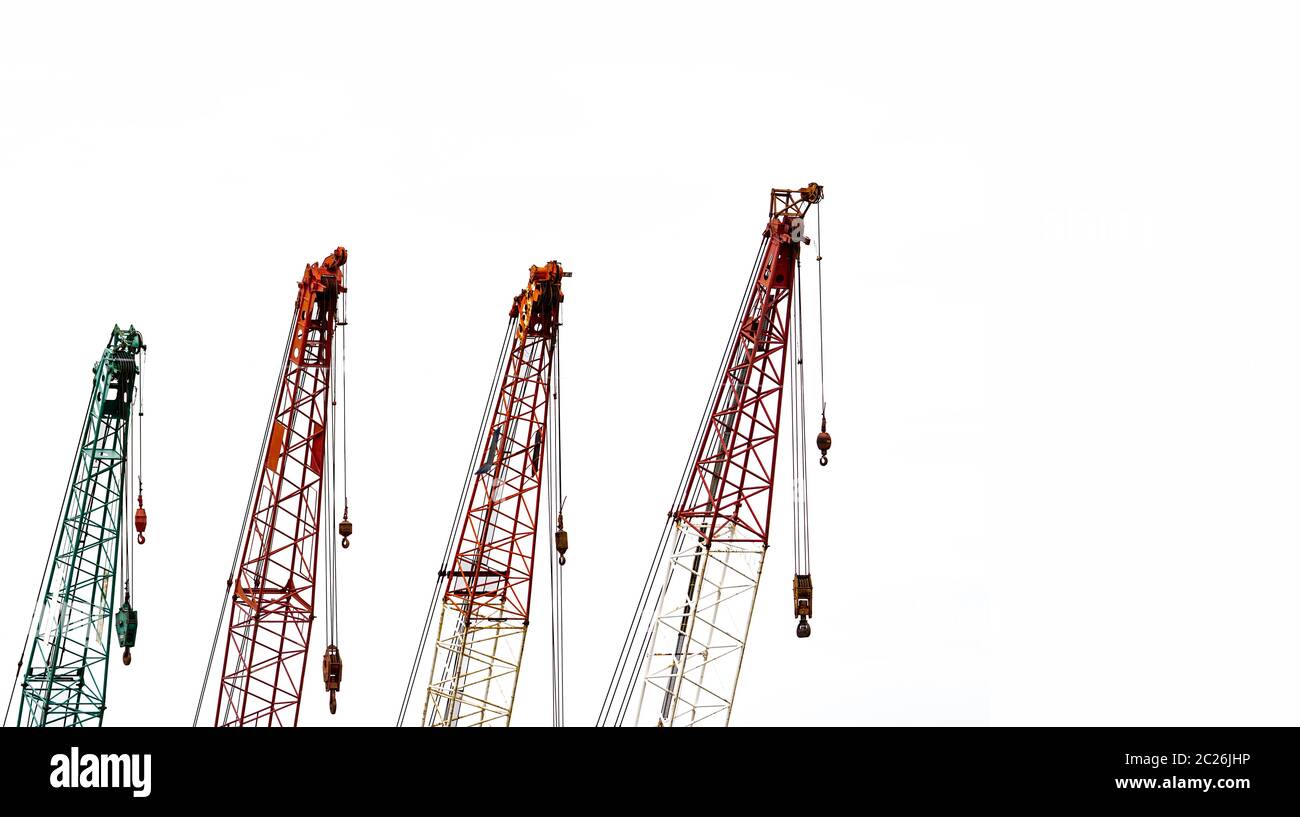 Set of big construction crane for heavy lifting isolated on white