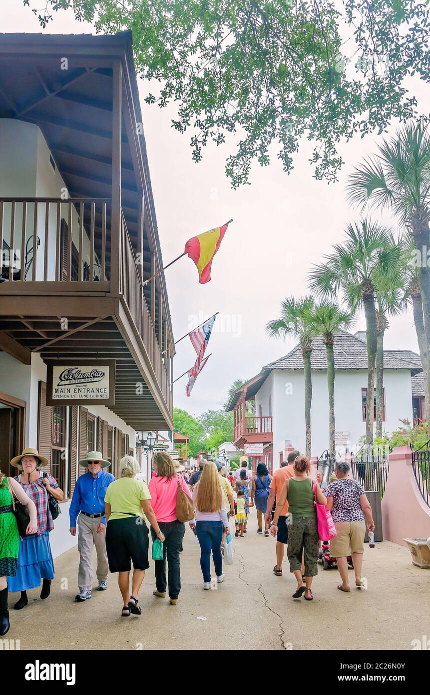 Tourists explore the shops on St. Street, April 11, 2015, in St