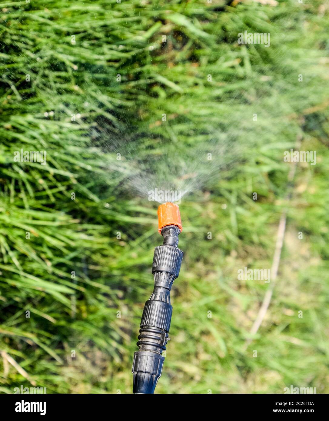 Spraying herbicide from the nozzle of the sprayer manual. Devices for