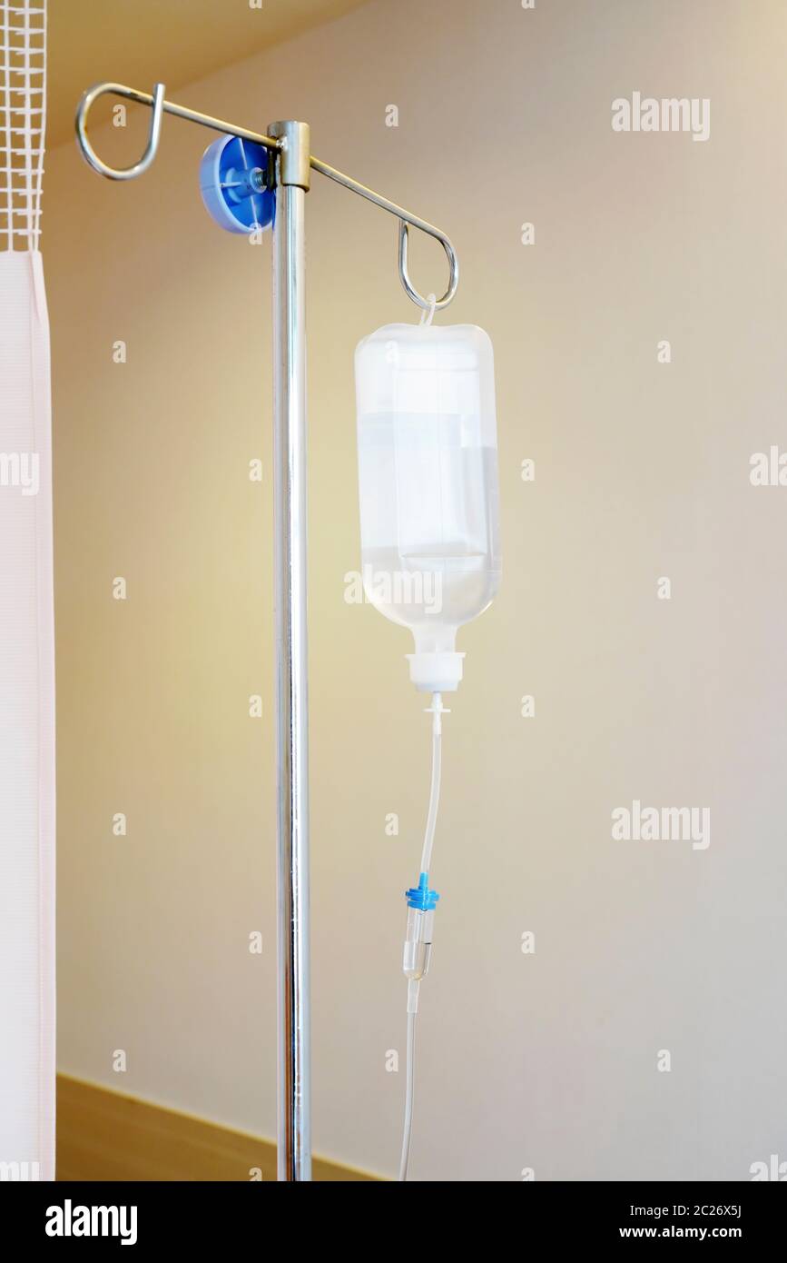 Saline solution drip for patient and infusion pump in hospital Stock Photo