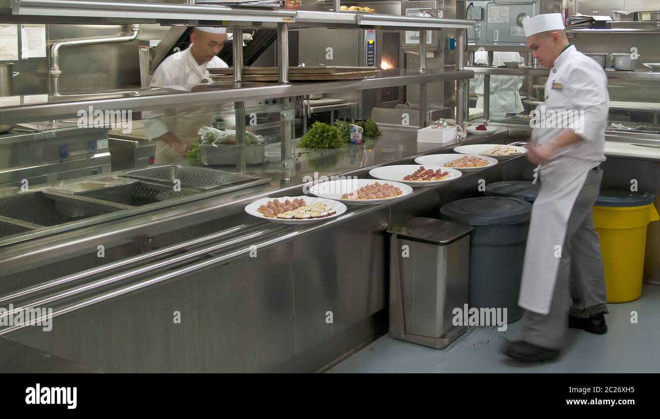 Chefs working in galley of cruise ship Stock Photo