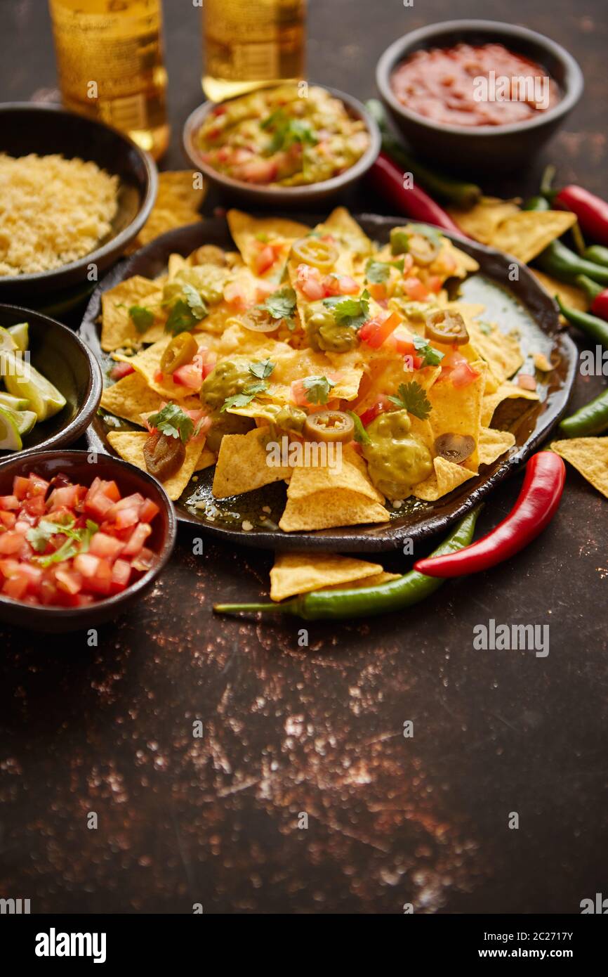 Fresh yellow corn nacho chips on ceramic plate Stock Photo Alamy