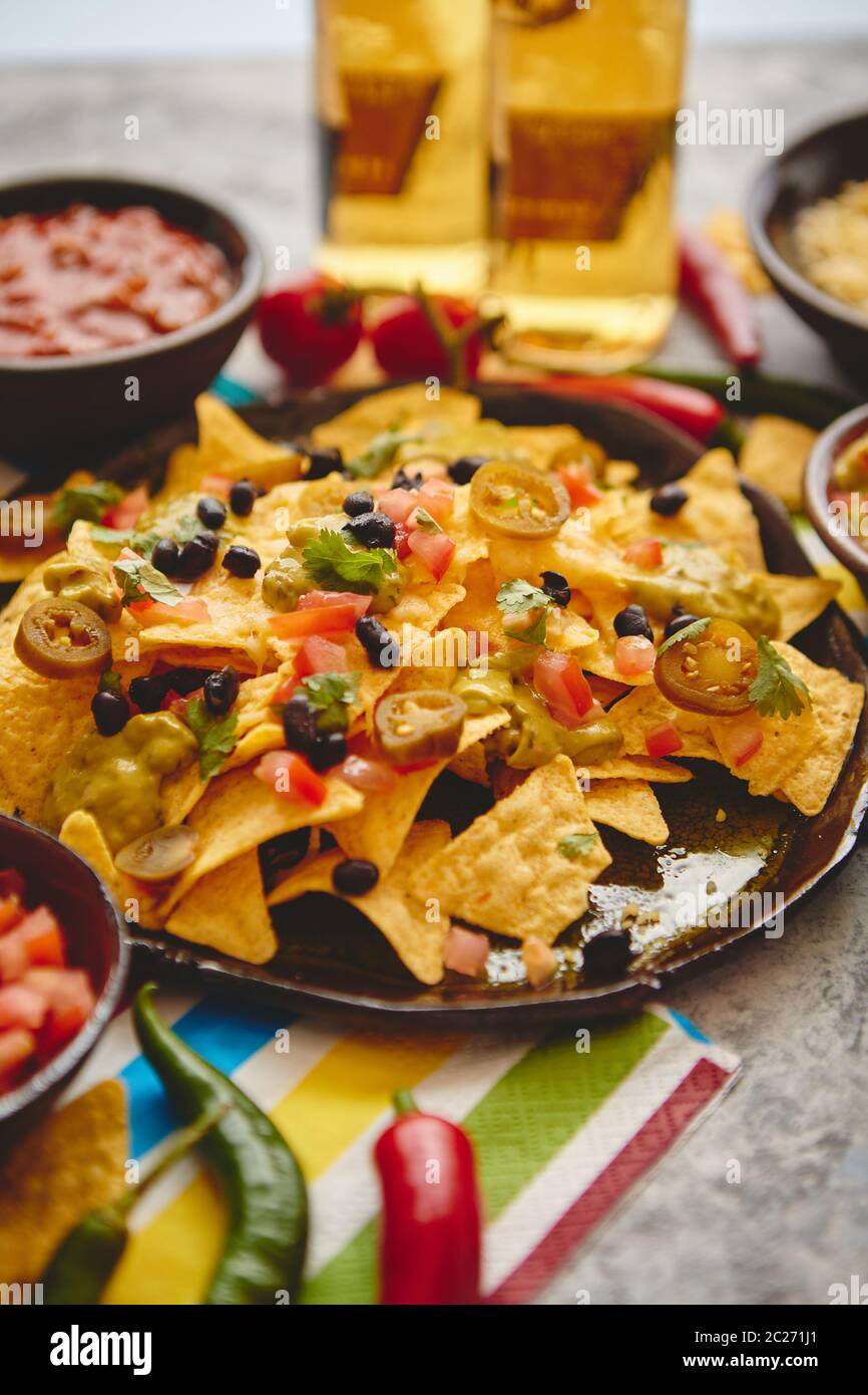 Mexican corn nacho spicy chips served with melted cheese Stock Photo