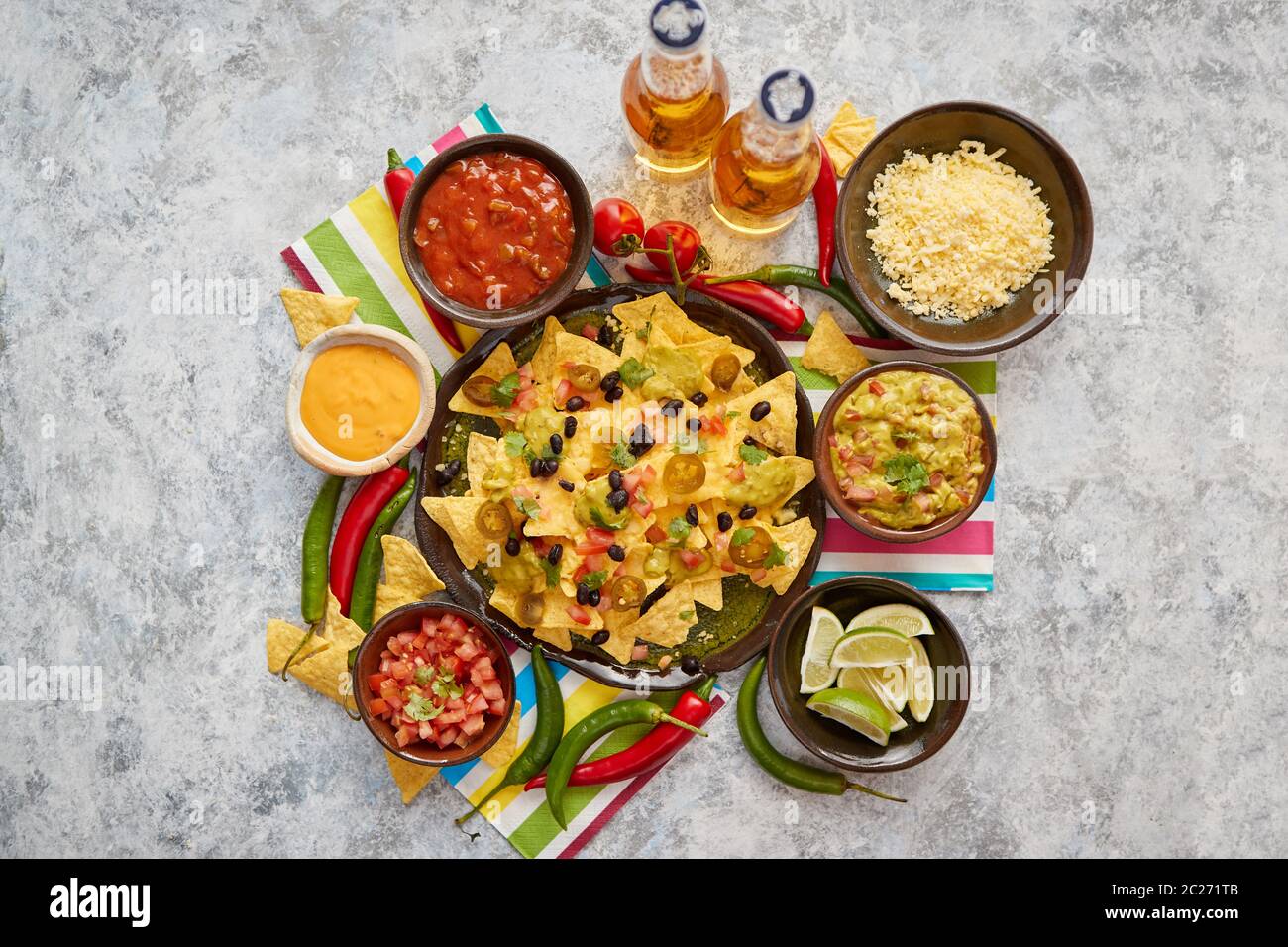 Mexican corn nacho spicy chips served with melted cheese Stock Photo