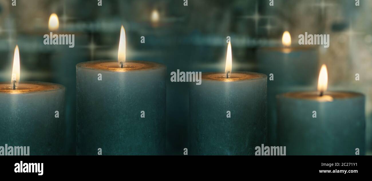 Candle lights with reflection on dark background Stock Photo - Alamy