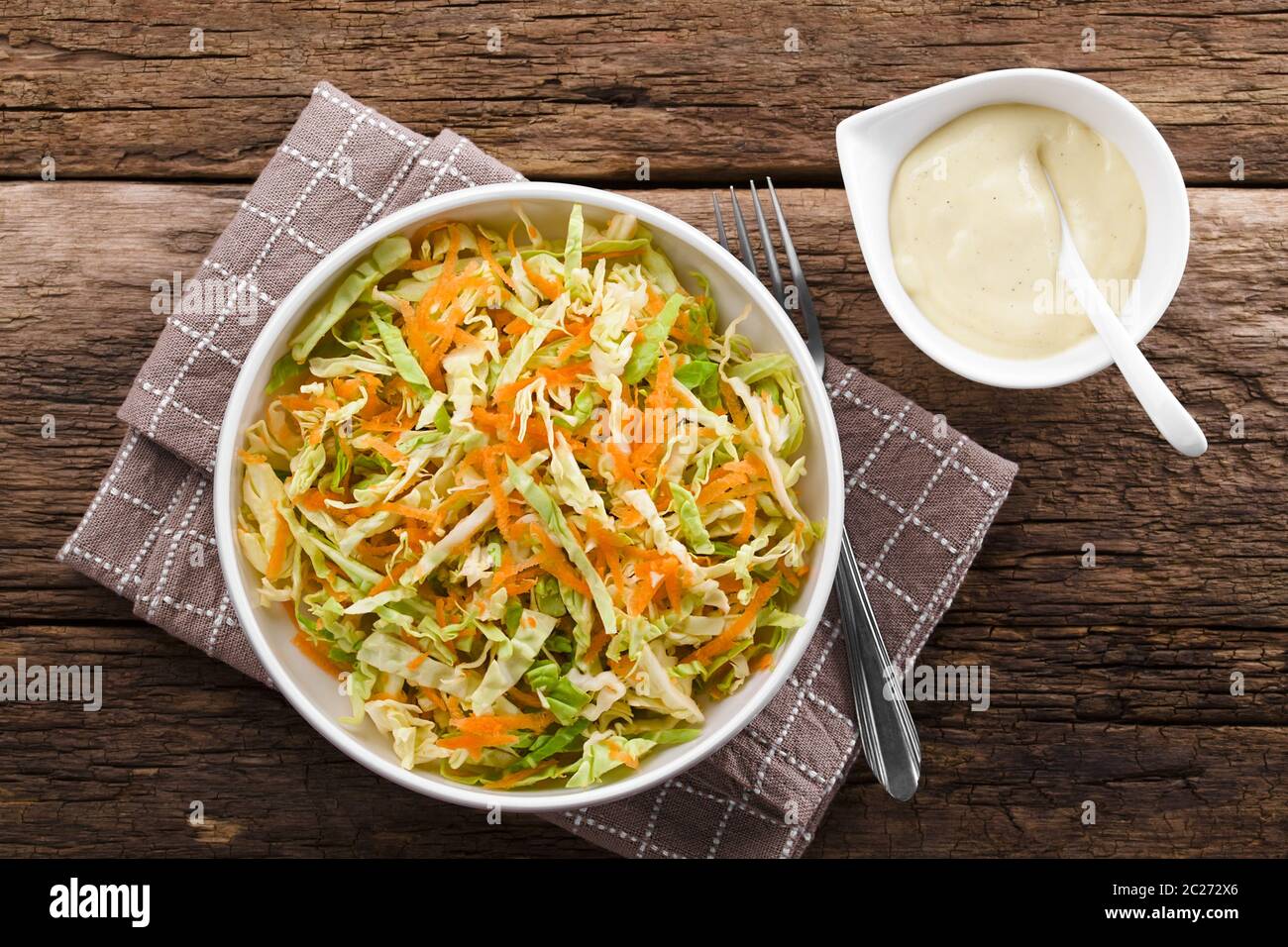 Coleslaw made of freshly shredded white cabbage and grated carrot with