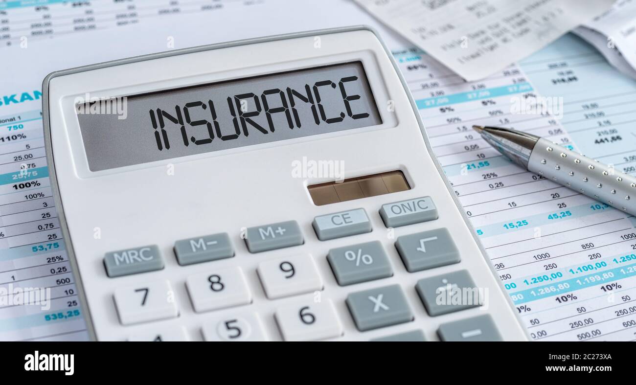 A calculator with the word Insurance on the display Stock Photo