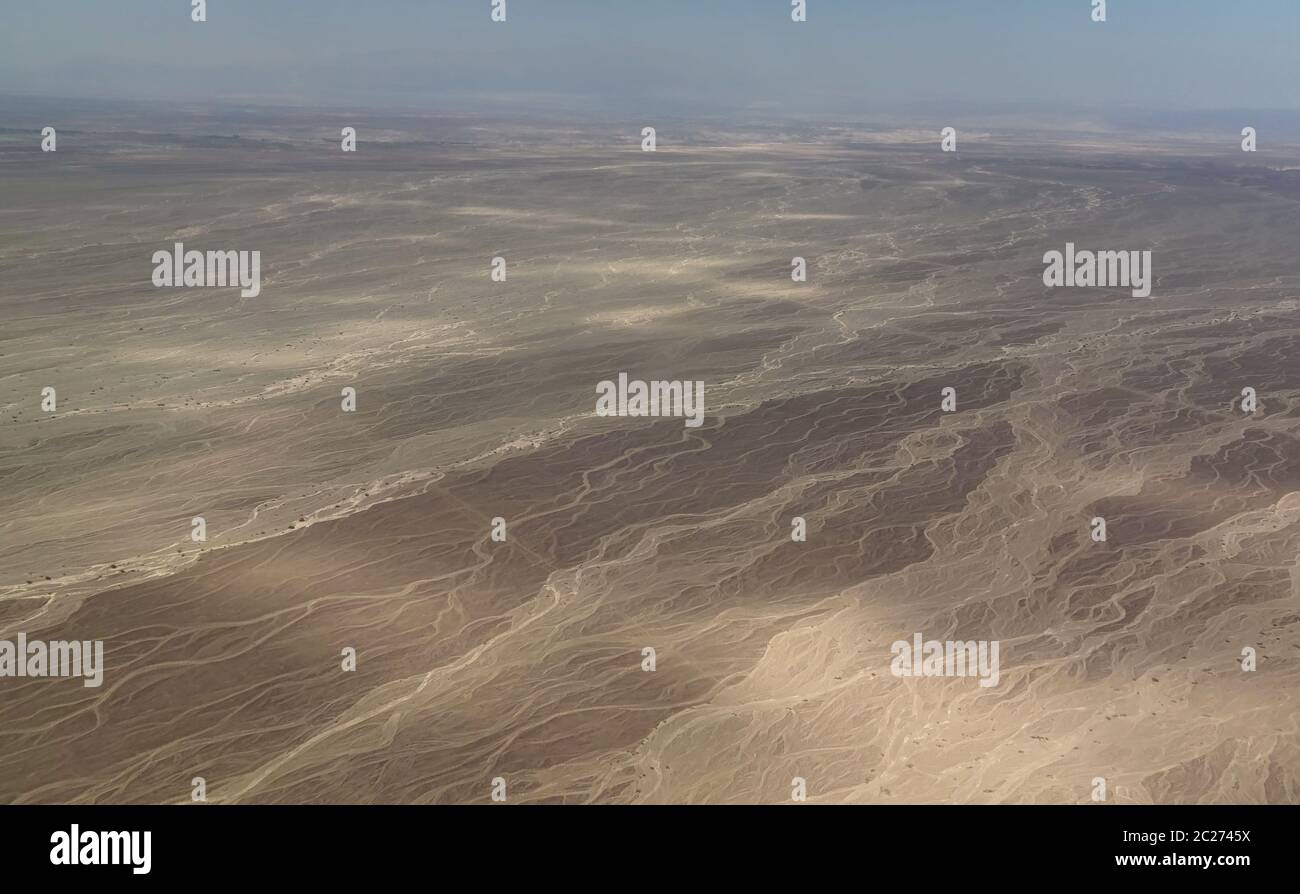 Aerial airplane panoramic view to Nazca plateau with geoglyph lines , Ica, Peru Stock Photo