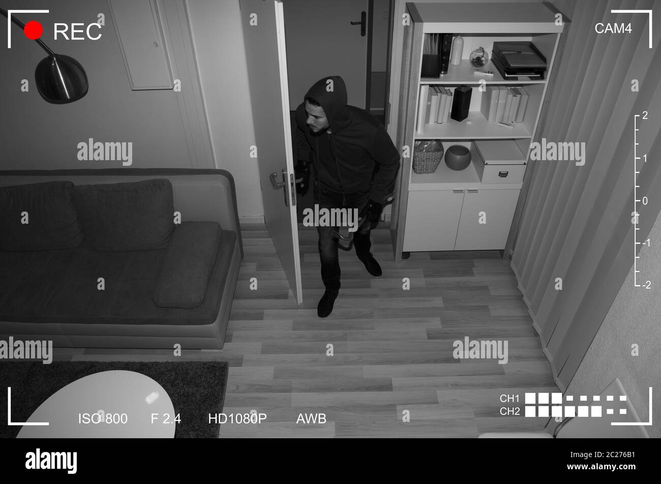 Thief With Crowbar Entering Into House Scene Through CCTV Camera Stock Photo